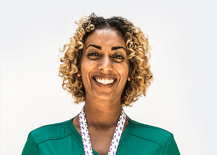 A healthcare professional smiling